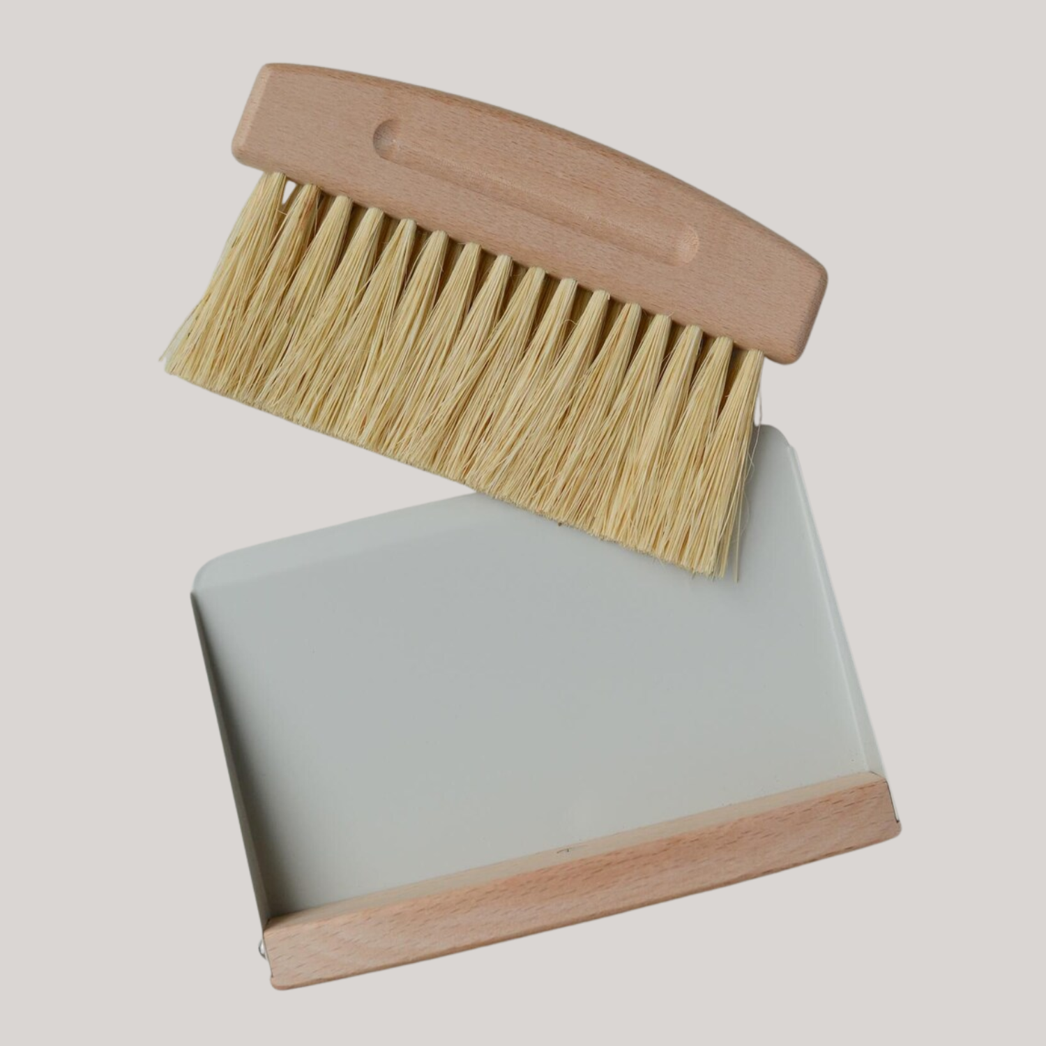 A handmade brush and pan set