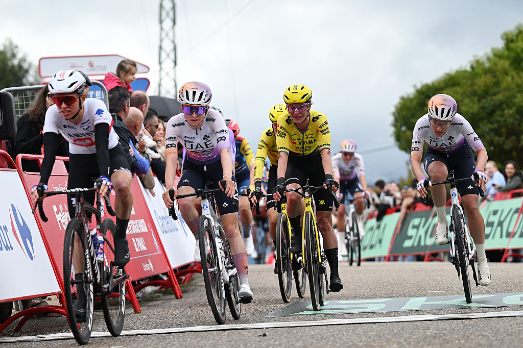 SALVATERRA DE MINO, SPAIN - MAY 03: (L-R) Maeva Squiban of France and UAE Team ADQ, Marianne Vos of Netherlands and Team Visma | Lease a Bike and Karlijn Swinkels of Netherlands and UAE Team ADQ cross the finish line during the 12th La Vuelta Femenina 2026, Stage 1 a 113.9km stage from Marin to Salvaterra de Mino / #UCIWWT / on May 03, 2026 in Salvaterra de Mino, Spain. (Photo by Szymon Gruchalski/Getty Images)