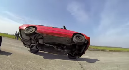 Watch this driving pro balance a car on two wheels