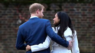 Prince Harry and actress Meghan Markle attend an official photocall to announce their engagement at The Sunken Gardens at Kensington Palace on November 27, 2017 in London, England. Prince Harry and Meghan Markle have been a couple officially since November 2016 and are due to marry in Spring 2018 on November 27, 2017 in London, England. (Photo by Steve Back/Getty Images)