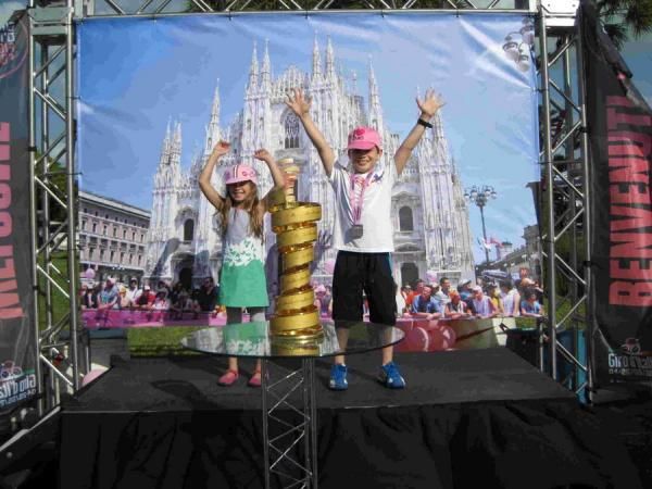 Young fans have their picture taken with the Giro d'Italia winner's trophy
