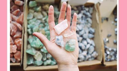Crystals for Beginners. Cropped Hand Of Woman Holding Crystals In Store