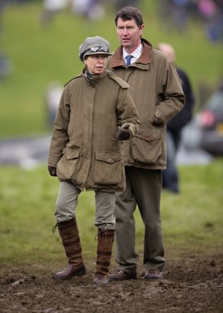 Princess Anne and husband Sir Timothy Laurence wear outdoor hunting gear