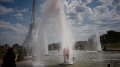 People in Paris try to escape record heat