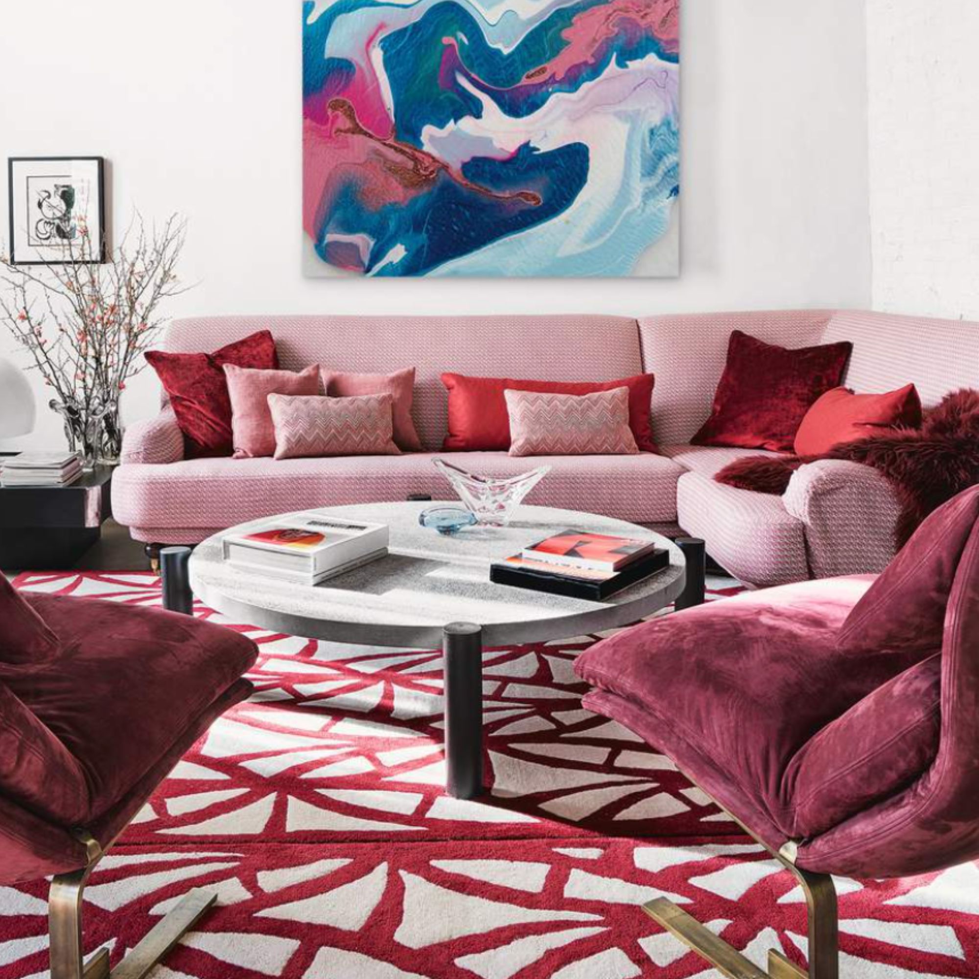 A red and white living room with a pink sofa and red and white patterned carpet