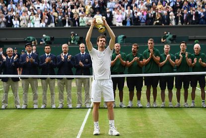 Andy Murray holds his trophy at Wimbledon