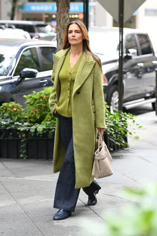 Katie Holmes wore brat green layers by Aligne while out in New York City on Sept. 24.