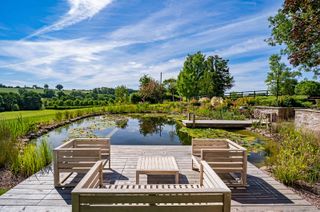 natural pool ideas with timber decking and seats