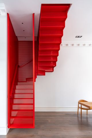 red floating staircase by michaelis boyd