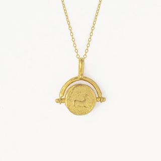 21ct gold plated brass pegasus coin spinner necklace with mother of pearl, £63, Ottoman Hands