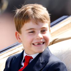 Prince Louis smiling in a carriage