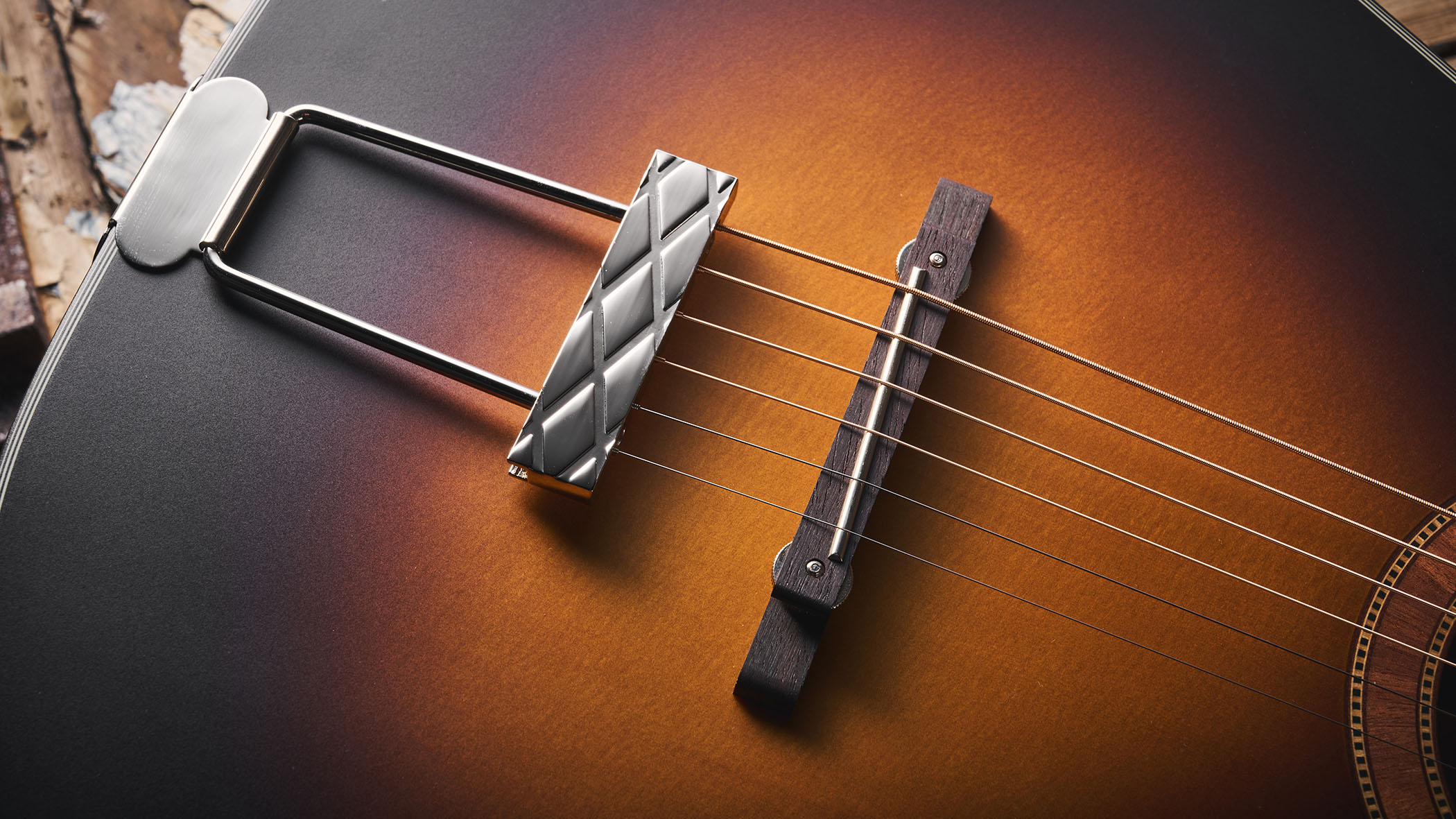 The Framus Hootenanny is inspired by the acoustics John Lennon used with the Beatles in the mid 1960s, and here is photographed in close-up against distressed wooden flooring.