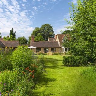 Lavish lawn and garden of a country-style property