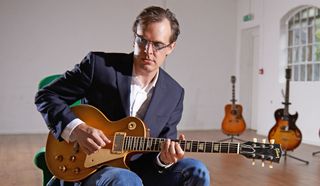 Portrait of American blues rock musician Joe Bonamassa photographed with a vintage 1952 Gibson Les Paul at John Henry's rehearsal space in London, on June 16, 2014.