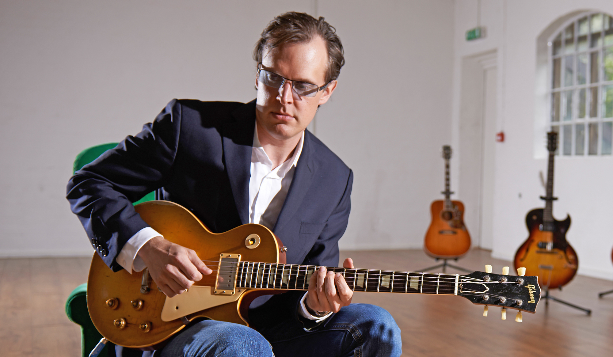 Portrait of American blues rock musician Joe Bonamassa photographed with a vintage 1952 Gibson Les Paul at John Henry's rehearsal space in London, on June 16, 2014.