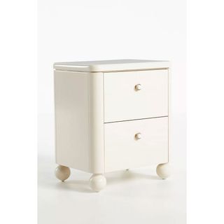 Off-white marble nightstand with two drawers and round feet