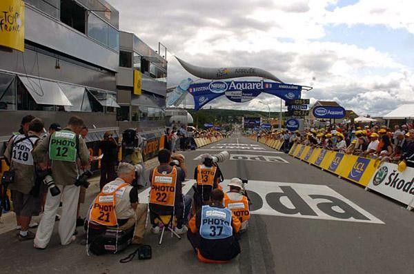 The photo crew await the arrival of the yellow jersey