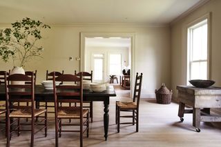 wooden dining table with chairs and serve