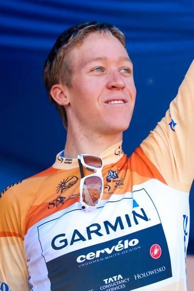 Cameron Meyer salutes the huge crowd on the podium.
