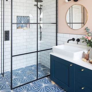 peach and blue bathroom with walk in shower