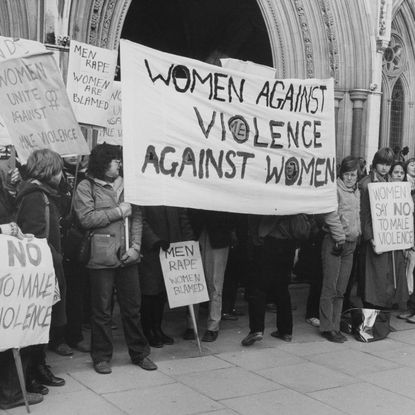 Women Against Violence Against Women activists stage a protest outside the High Court at the Royal Courts of Justice in Westminster, London, England, 7th January 1981. They are protesting against Judge Bertram Richards' decision to fine, rather than imprison, John Allen who had raped a teenage hitchhiker. (Photo by Gary Stone/Central Press/Hulton Archive/Getty Images)