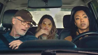 ed harris and Sonequa Martin-Green ride in the front seat while natalie morales sits in the backseat of a car in the movie my dead friend zoe