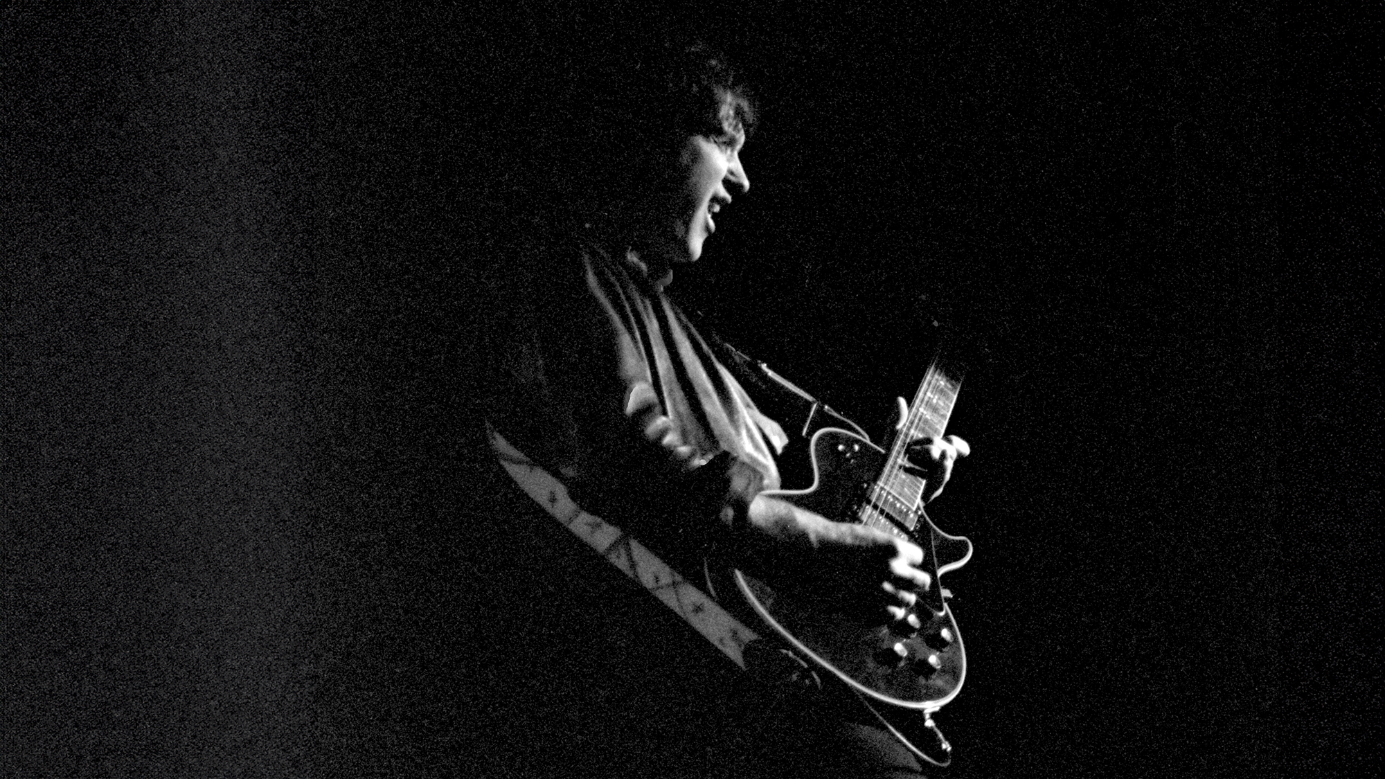 English musician Dave Davies performing with The Kinks at the Lyceum Theatre, London, England on 22 December 1982.