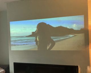 XGIMI Halo+ Portable Projector projecting an image onto a blank wall