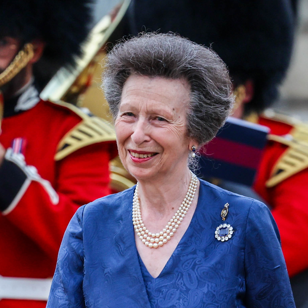 Princess Anne wears a pearl necklace and blue dress