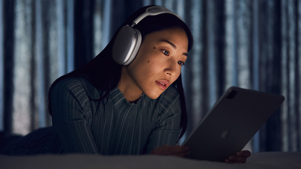 A woman wearing Apple AirPods Max