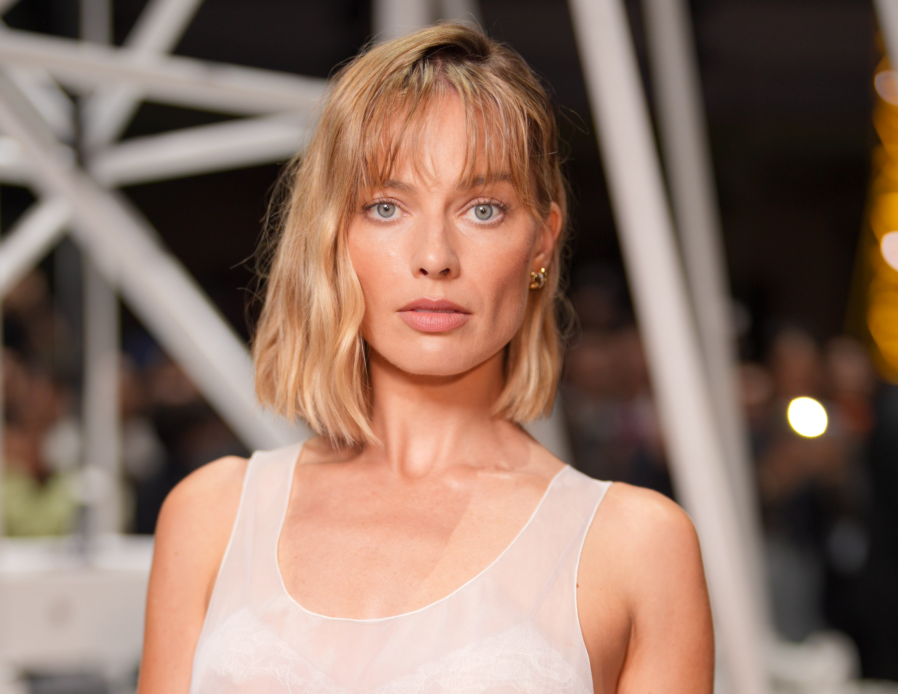 a white woman with short hair pictured at a fashion show