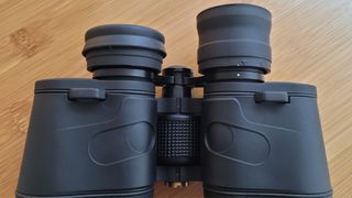 Close up of the Celestron SkyMaster 12x60 eye cups. One folded, one not.