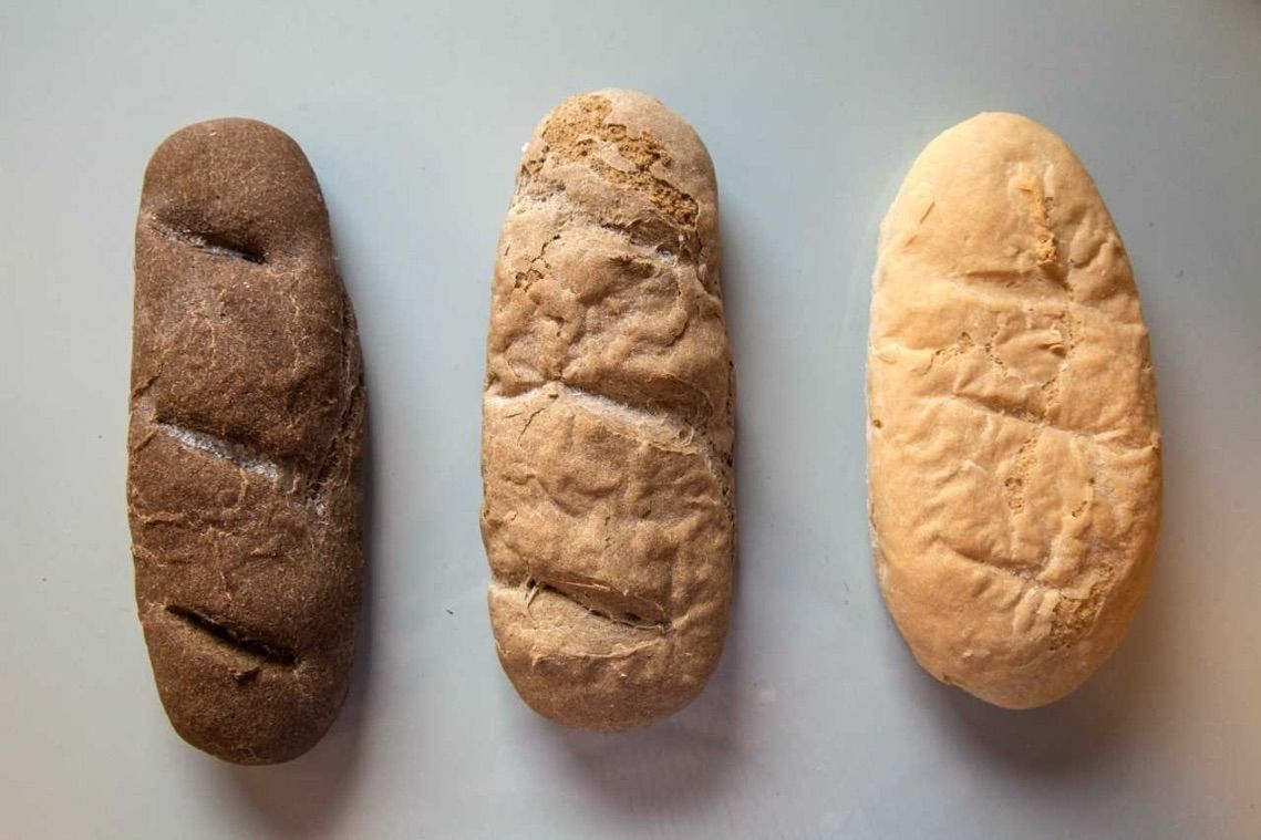 Three breads produced with different blends of wheat four and, from left to right, 30 percent, 10 percent and zero percent cricket powder. The more cricket powder was used, the darker the color.