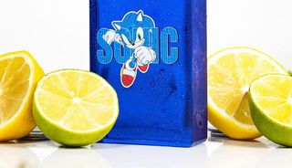 Sonic the Hedgehog cologne surrounded by citrus fruit.