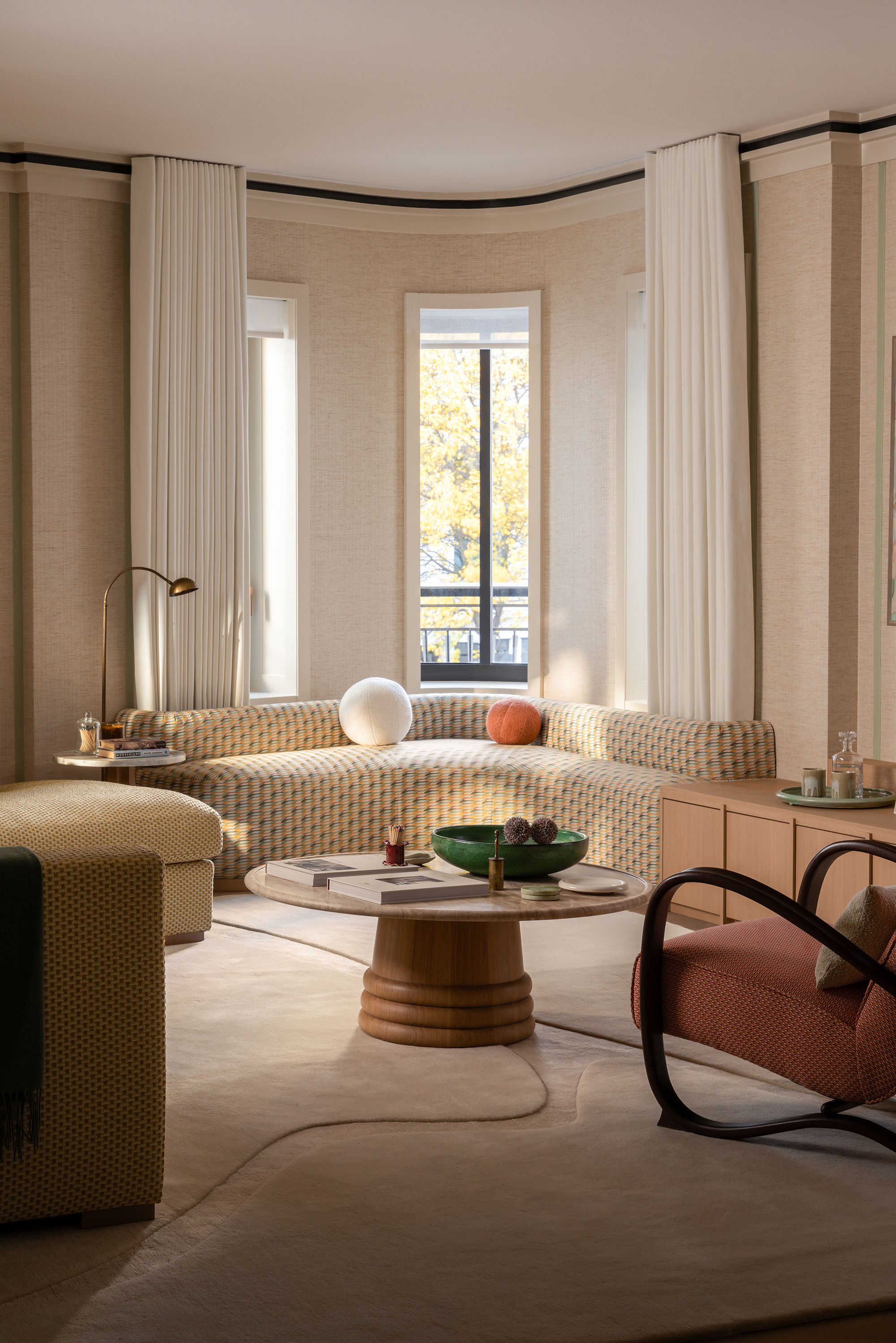 living room with curved banquette in a curved window