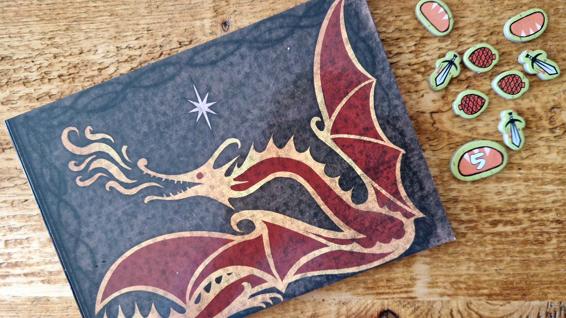 The Hobbit: There &amp;amp; Back Again components laid out on a wooden surface