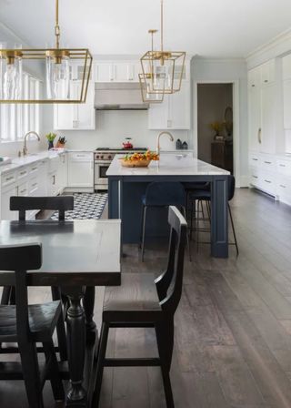 farmhouse kitchen diner with white kitchen cabinetry and blue kitchen island