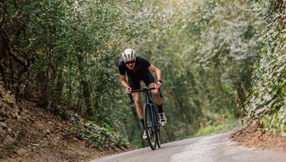 Male cyclist riding hard to improve his vo2 max