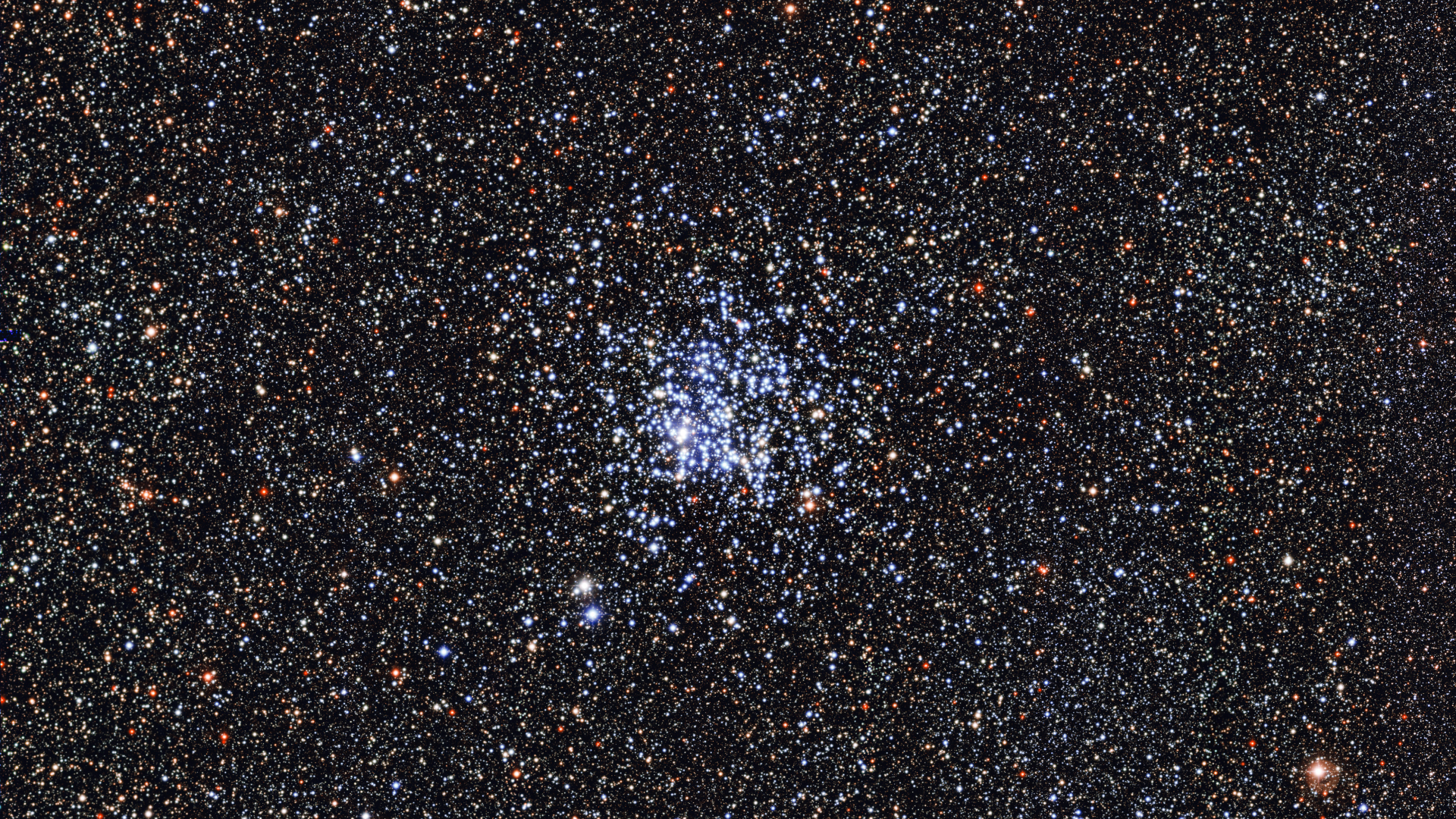 A deep space image showing a dense cluster of bright blue stars