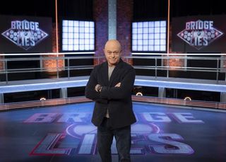 Bridge Of Lies host Ross Kemp ask questions and roots for the contestants as they make their way across studio stepping stones..