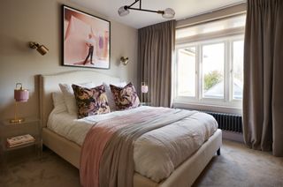 Dani Ellis home: bedroom with plush carpet and velvet curtains, upholstered bed and clear glass bedside tables