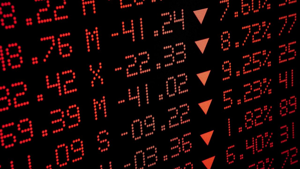 stock market ticker board in red