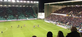 Hearts players and fans celebrate an away win