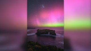 Purple and green northern lights over Bakers Oven, Australia.