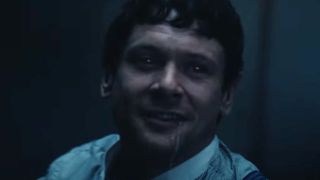 Jack O’Connell flashing in menacing grin in Sinners