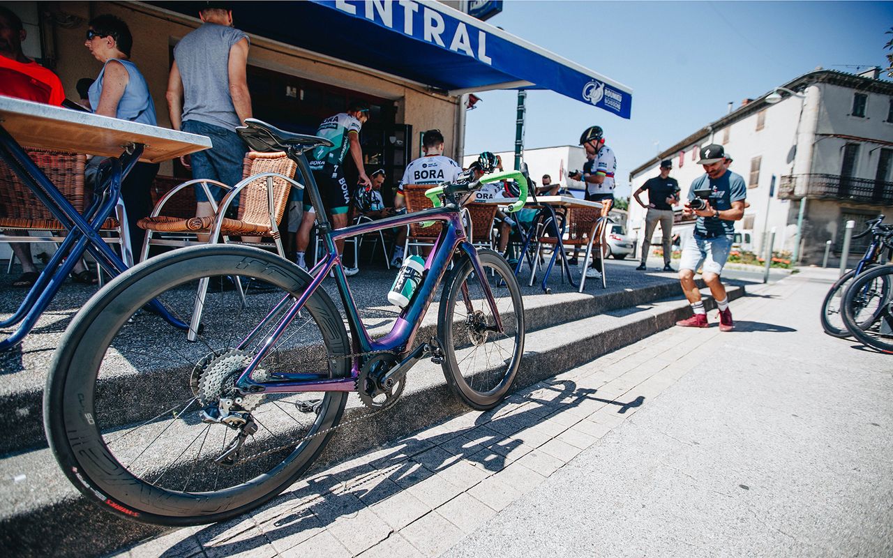 The new e-bike sits outside the cafe stop in Albi