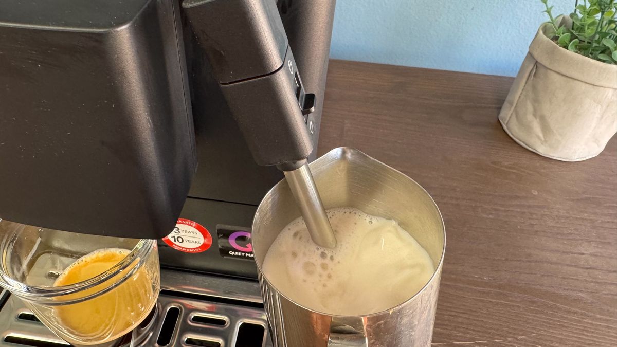 Milk being steamed using the wand on the KitchenAid KF2