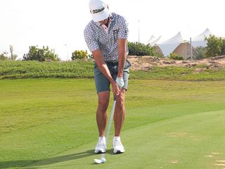 Rafa Cabrera Bello demonstrating the 50-yard pitch shot at impact