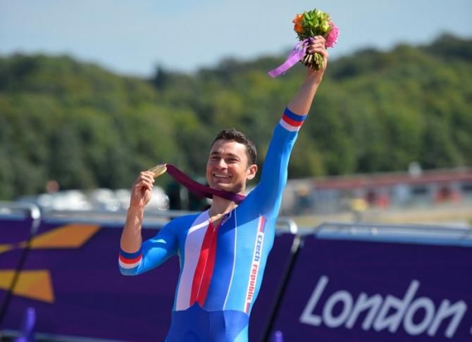 Czech Republic's Jiri Jezek celebrates after winning the gold medal in the men's individual C4 time trial road cycling finals in London Paralympics in 2012