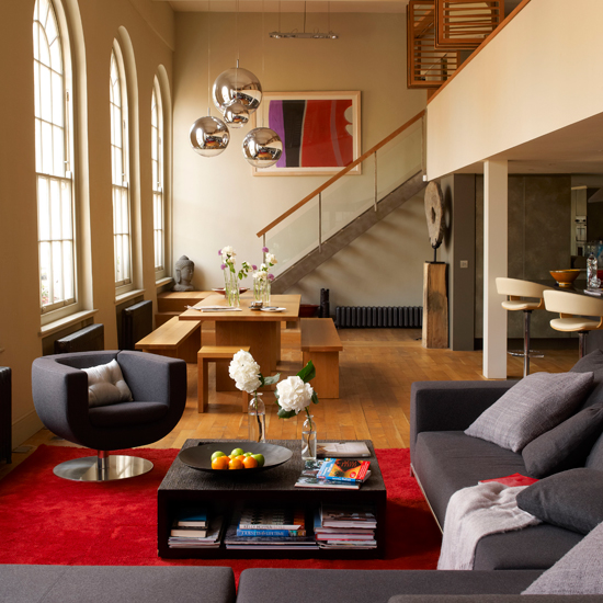living room with semiarched windows and sofaset with cushions